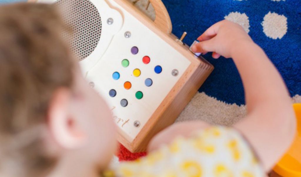 A child is adjusting the volume