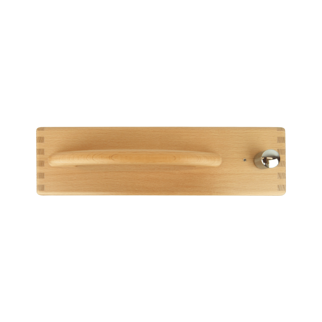 A photograph of the Hörbert taken from above. You can see the handle, the dial and the LED indicator light.